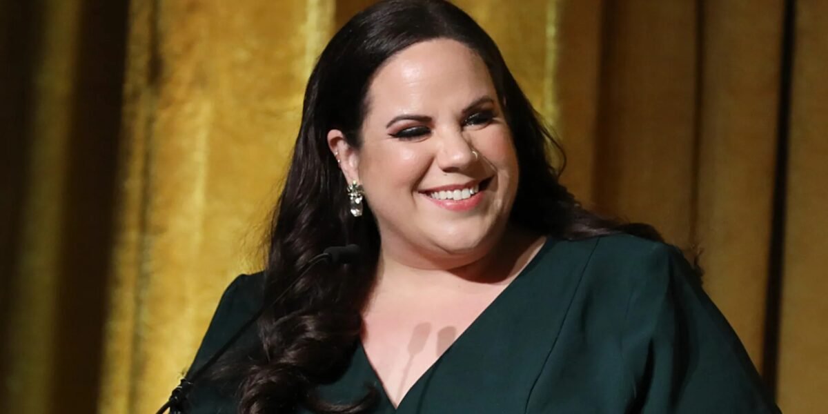 Whitney Way Thore smiling at a red carpet event