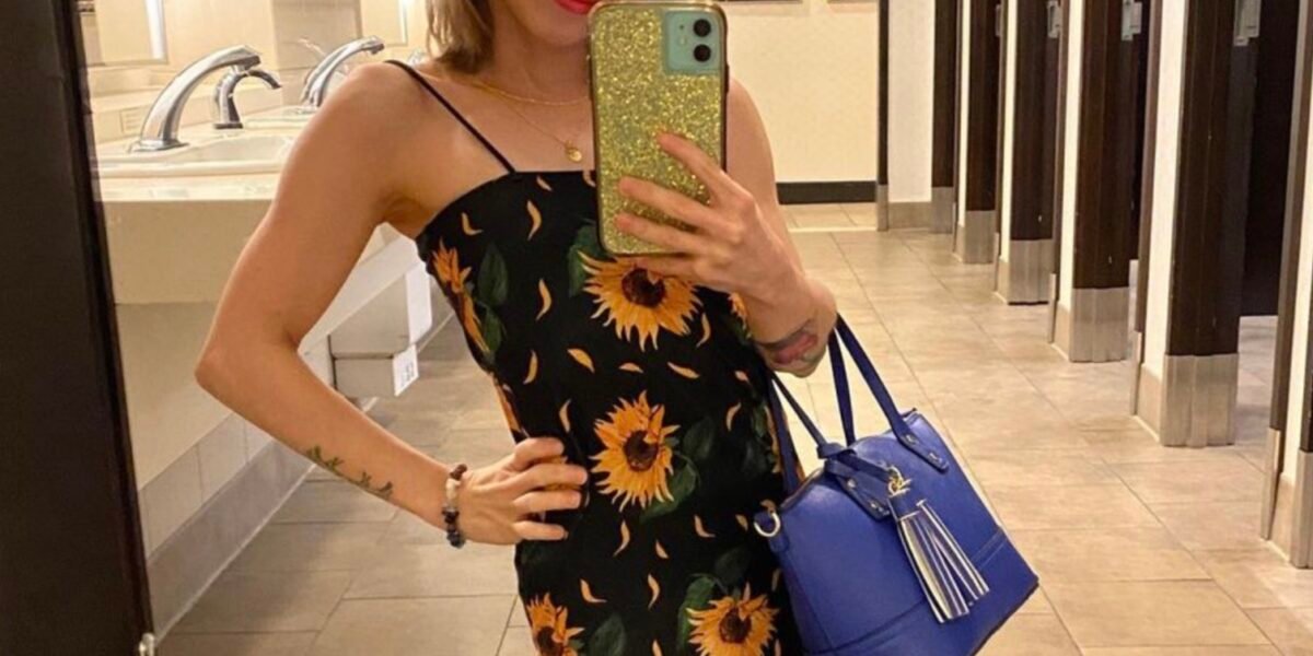 Shauna Rae takes a mirror selfie in a sunflower dress — the 27-year-old woman at the center of the independence debate