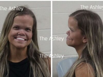 Anna Johnston smiling in her mugshot after her DUI arrest in Georgia