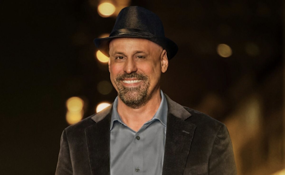 Gino Palazzolo smiling in a promotional photo