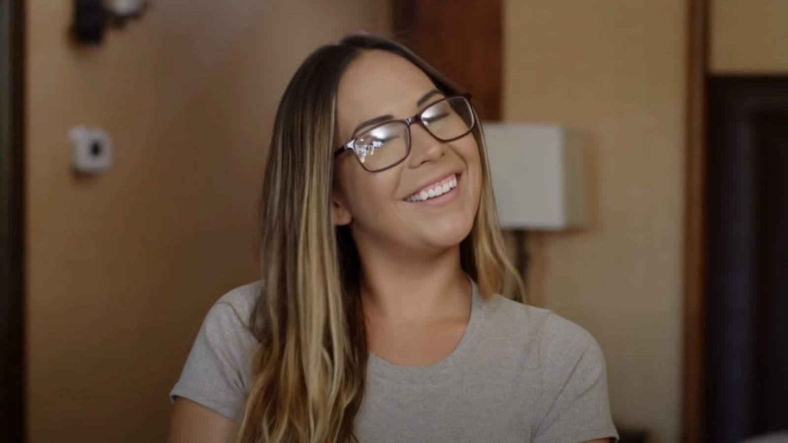 Liz Woods laughing wearing glasses