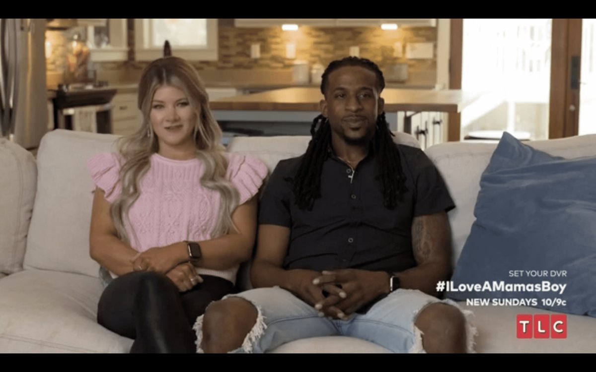 Abbey and Tre from I Love a Mama's Boy sitting on a couch