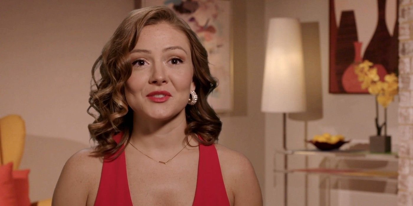Kara Leona in a red-dress confessional