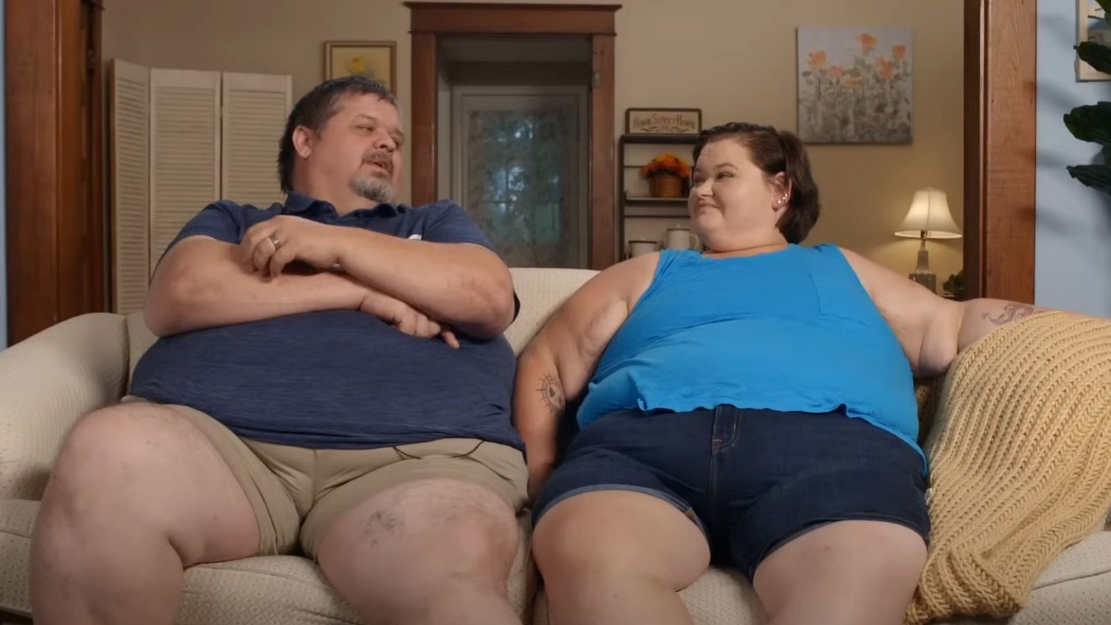 Chris and Brittany Combs talking at home