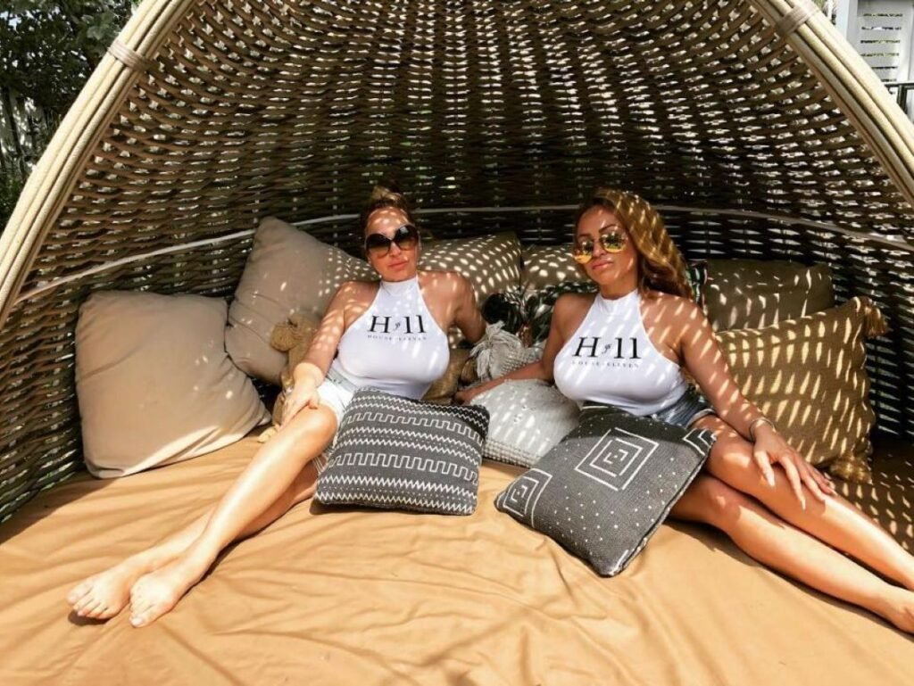 Darcey and Stacey Silva wearing House of Eleven branded tops