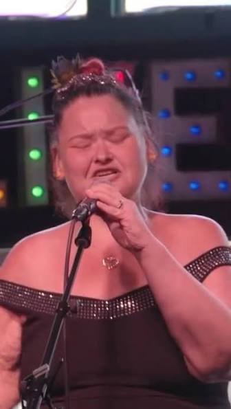 Amy Slaton singing on stage