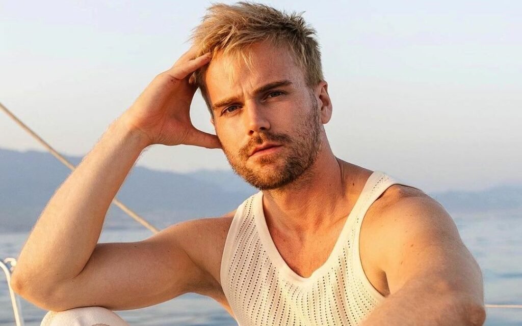 Jesse Meester posing on a boat in Spain