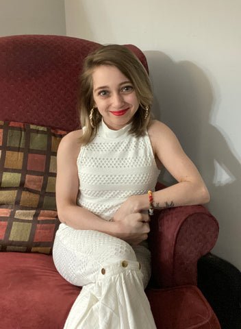 Shauna Rae in a white jumpsuit during her DEWEY fashion interview