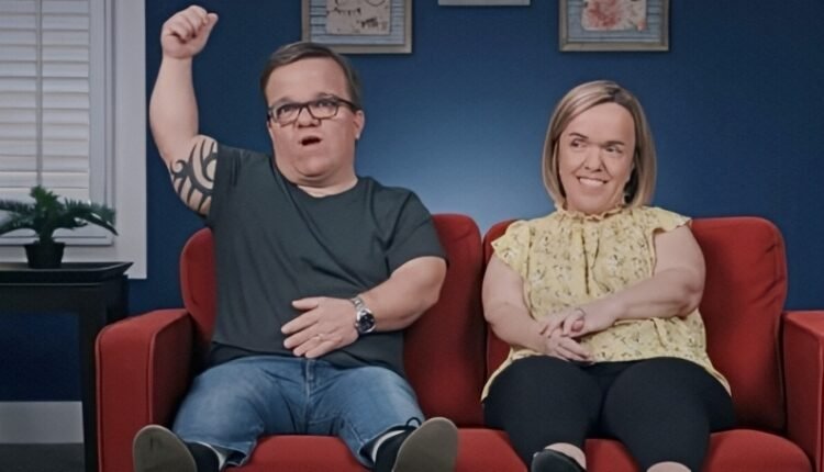 Trent Johnston raising a determined fist next to Amber Johnston