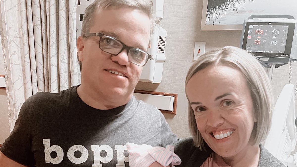 Trent and Amber Johnston at the hospital with their newborn granddaughter