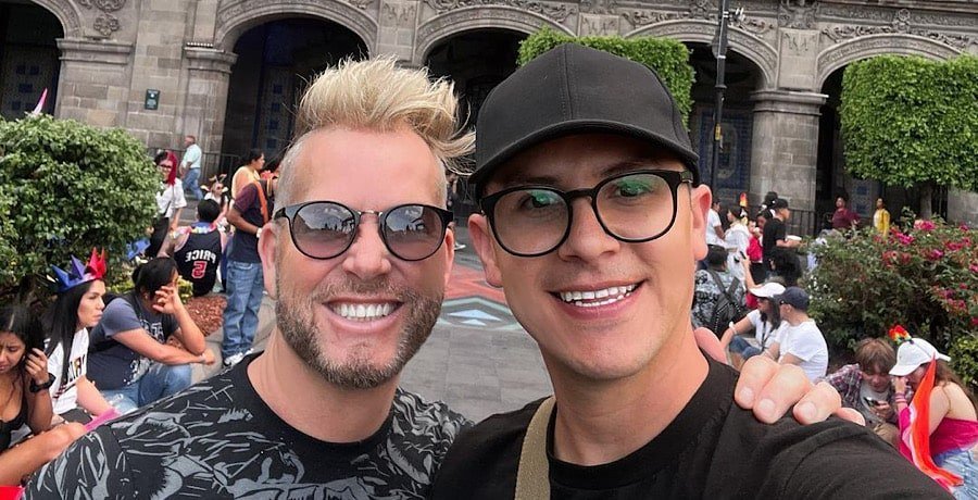Kenny Niedermeier and Armando Rubio smiling for an outdoor selfie