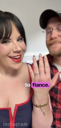 Whitney Way Thore showing her engagement ring