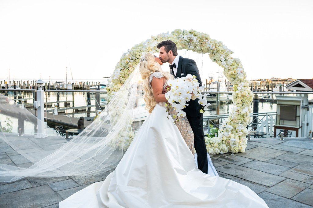 Stacey Silva and Florian Sukaj kissing at their wedding