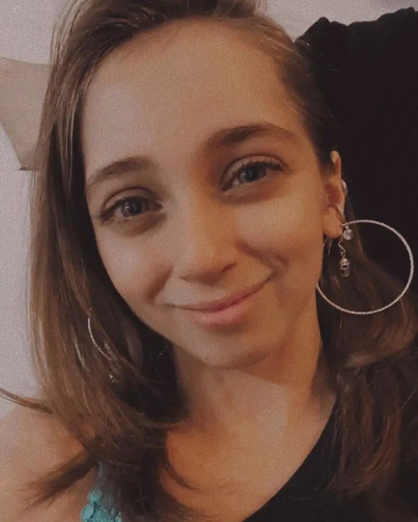 Shauna Rae in a candid selfie with hoop earrings