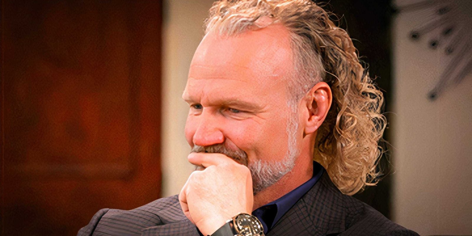 Kody Brown with long blonde curls during a confessional