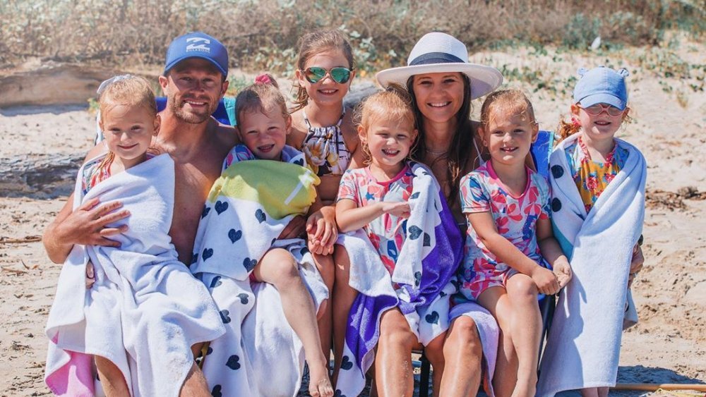The Busby quints as little girls on a beach trip with Adam and Danielle