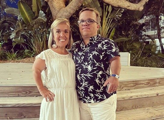 Trent and Amber Johnston smiling outdoors