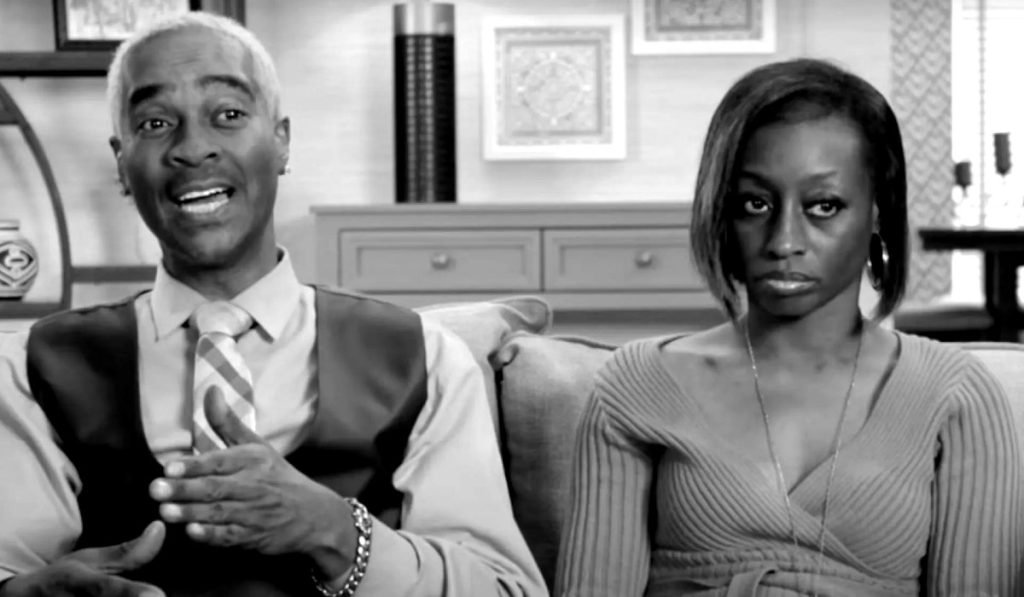Deon and Karen Derrico sitting apart during a confessional