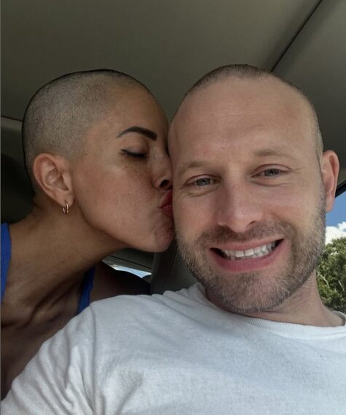 A playful car selfie of Jasmine with Matt