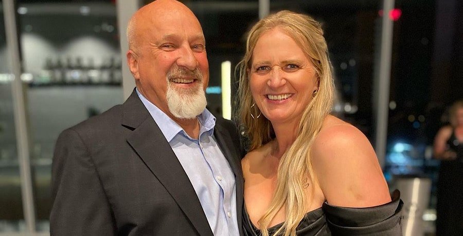 Christine Brown and David Woolley smiling together at an event