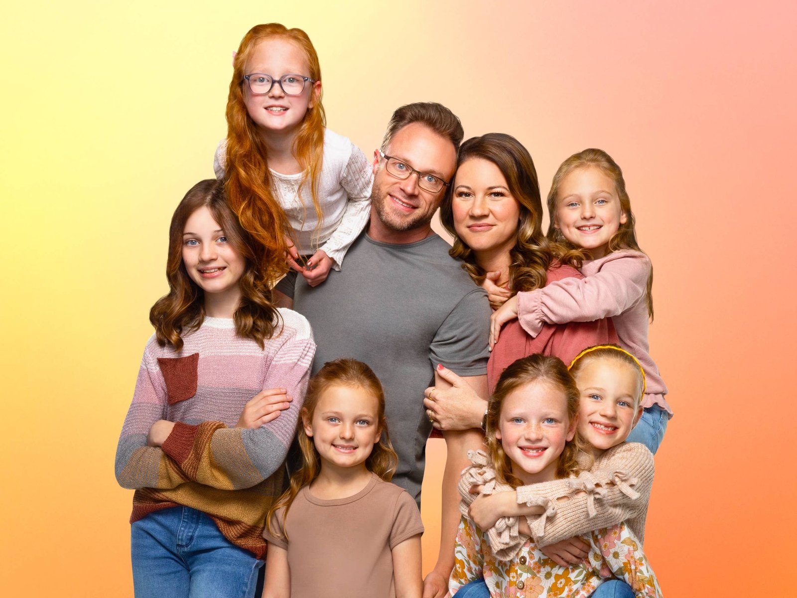 The Busby family posing together for a portrait