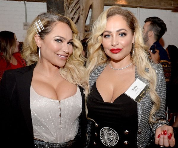Darcey and Stacey Silva smiling together at an event