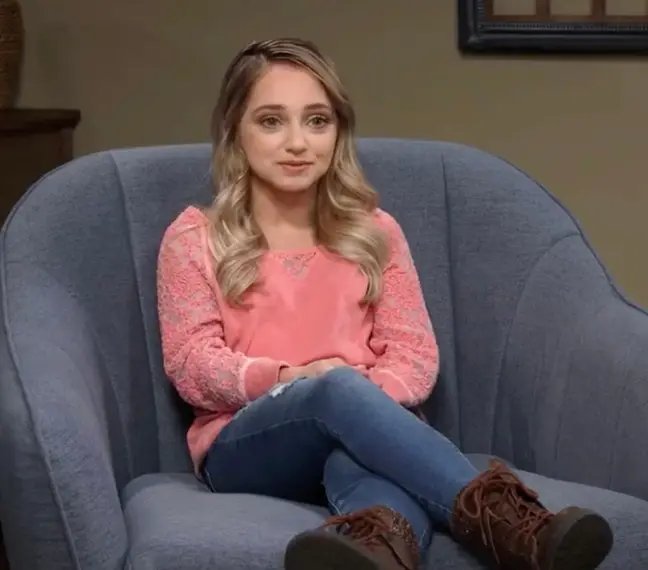 Shauna Rae sitting in a blue armchair in a confessional interview