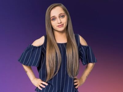 Shauna Rae standing confidently with her hands on her hips