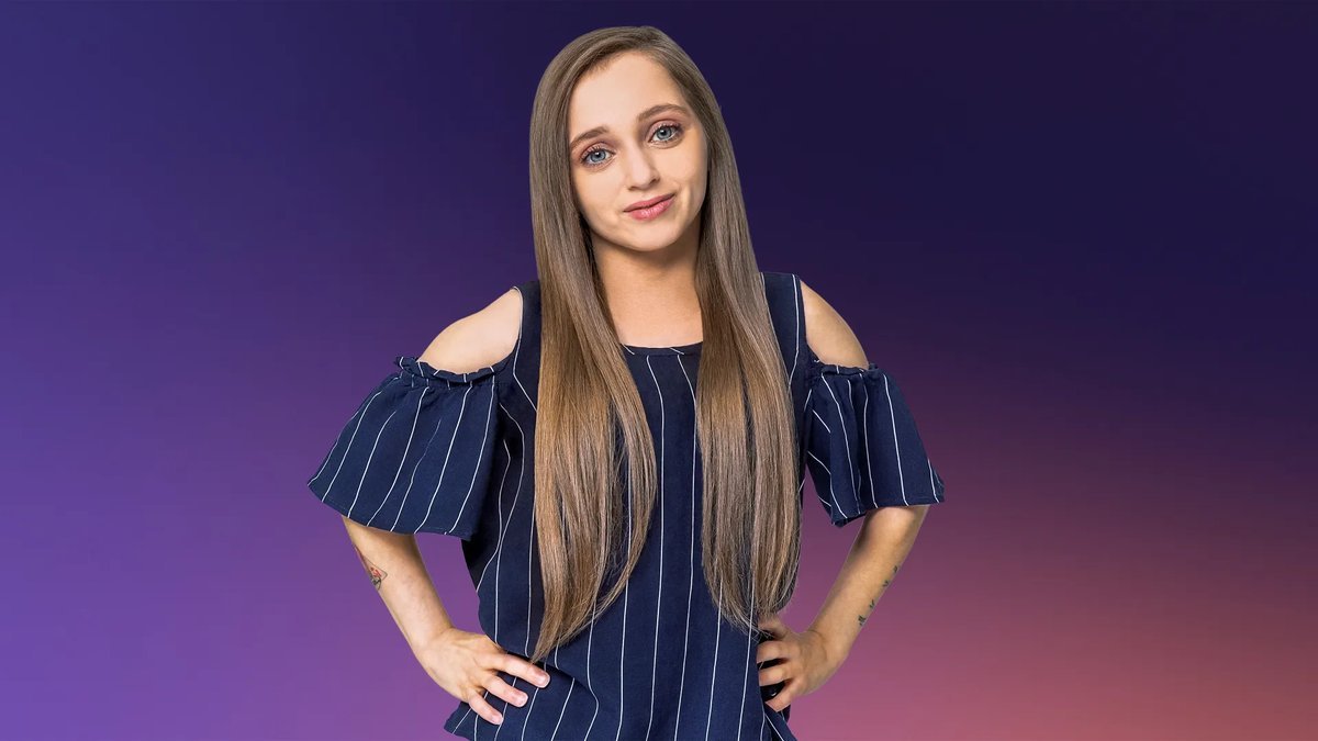 Shauna Rae standing confidently with her hands on her hips