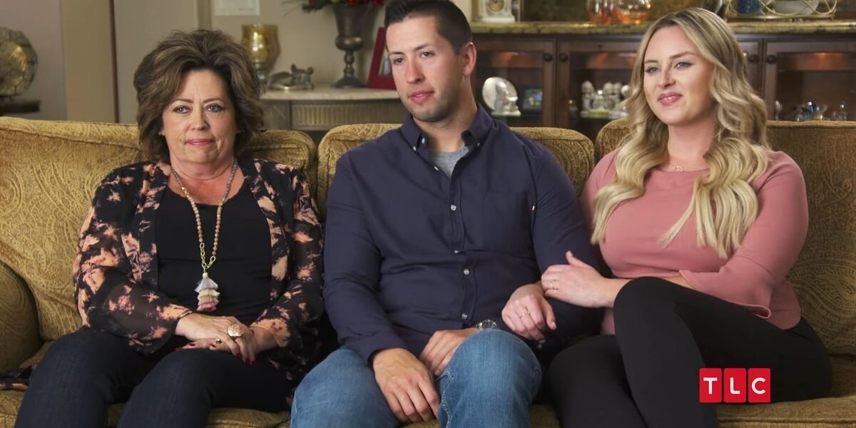 Kelly, Matt and Kim sitting together on a couch