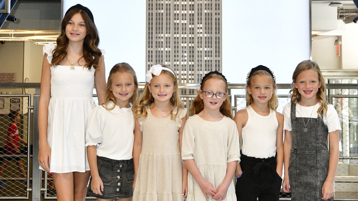 Blayke Busby with the five Busby quintuplets