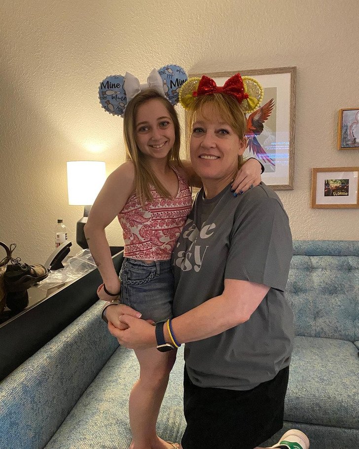 Shauna Rae smiling wearing Minnie Mouse ears on a day out