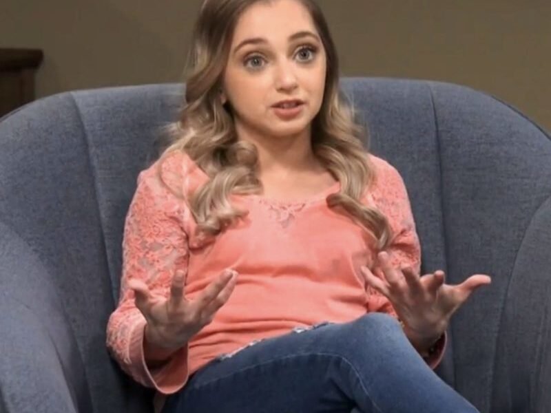 Shauna Rae speaking animatedly in a confessional interview