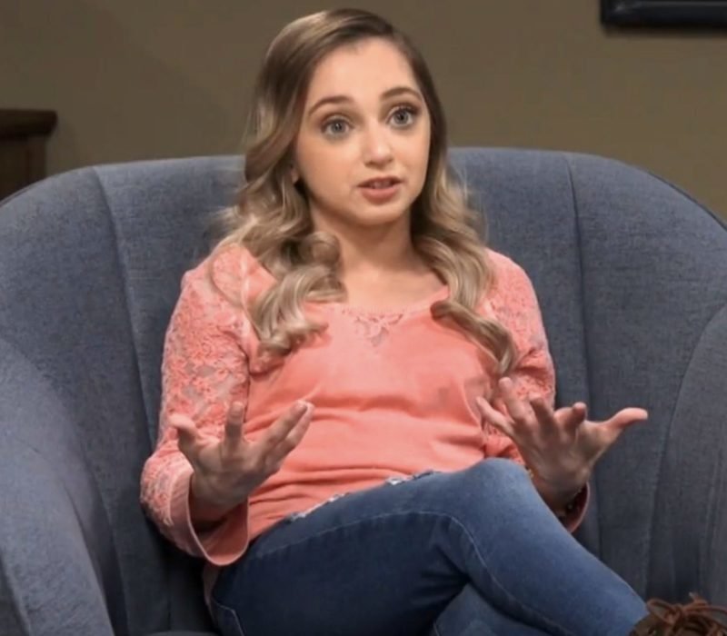 Shauna Rae speaking animatedly in a confessional interview