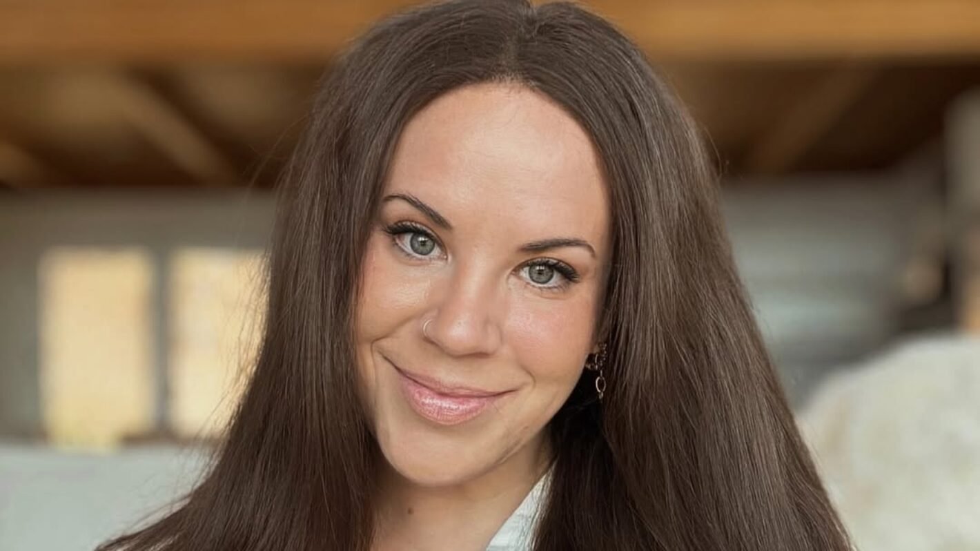Whitney Thore smiling in a close-up portrait