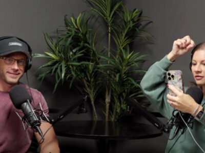 Adam and Danielle Busby recording the More Than Reality podcast with microphones