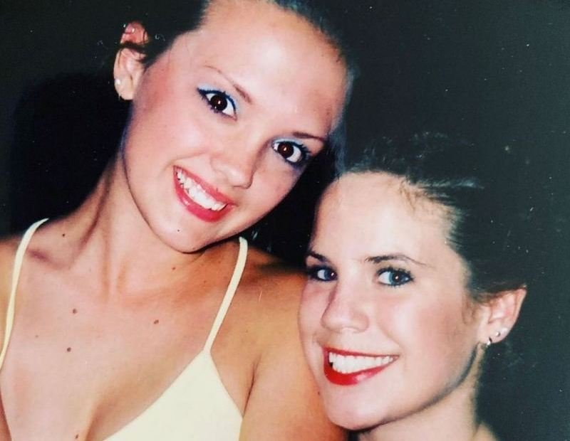 Young Whitney Thore smiling in a throwback photo