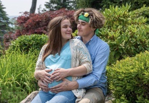 Kylen Smith and Jason Korpi outdoors during her pregnancy