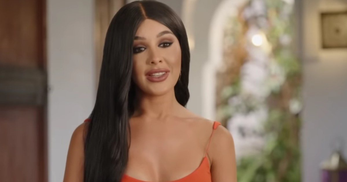 Emma Perry in an orange top at the Hunt for Love resort
