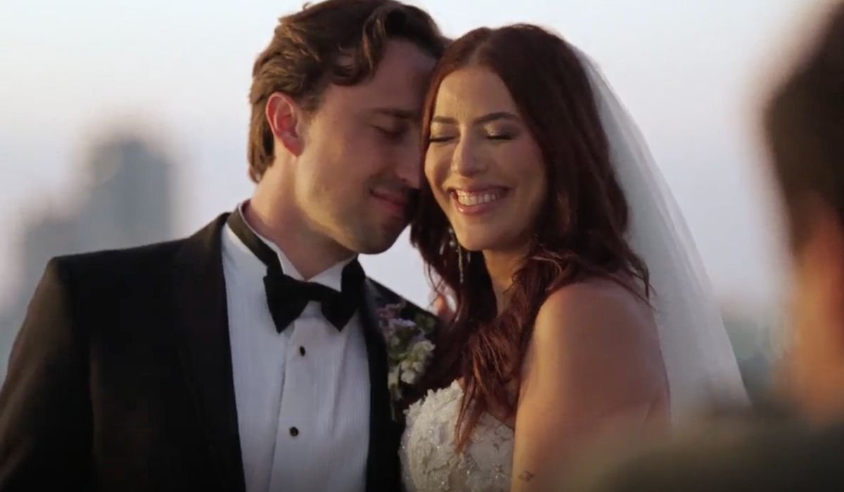 Thomas Dintino and Paula Barbosa smiling at their wedding