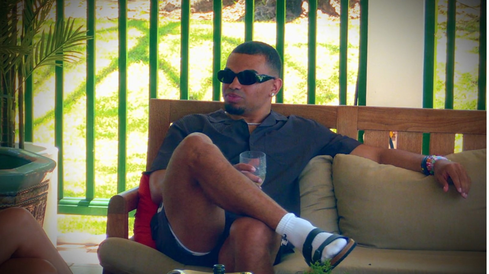 Brian lounging in the Hunt for Love Season 2 villa